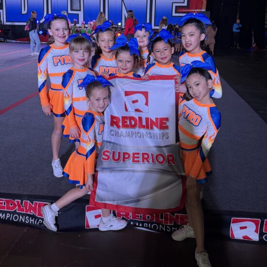 Pyro Novice PYRO Cheer novice team performing at cheerleading competition